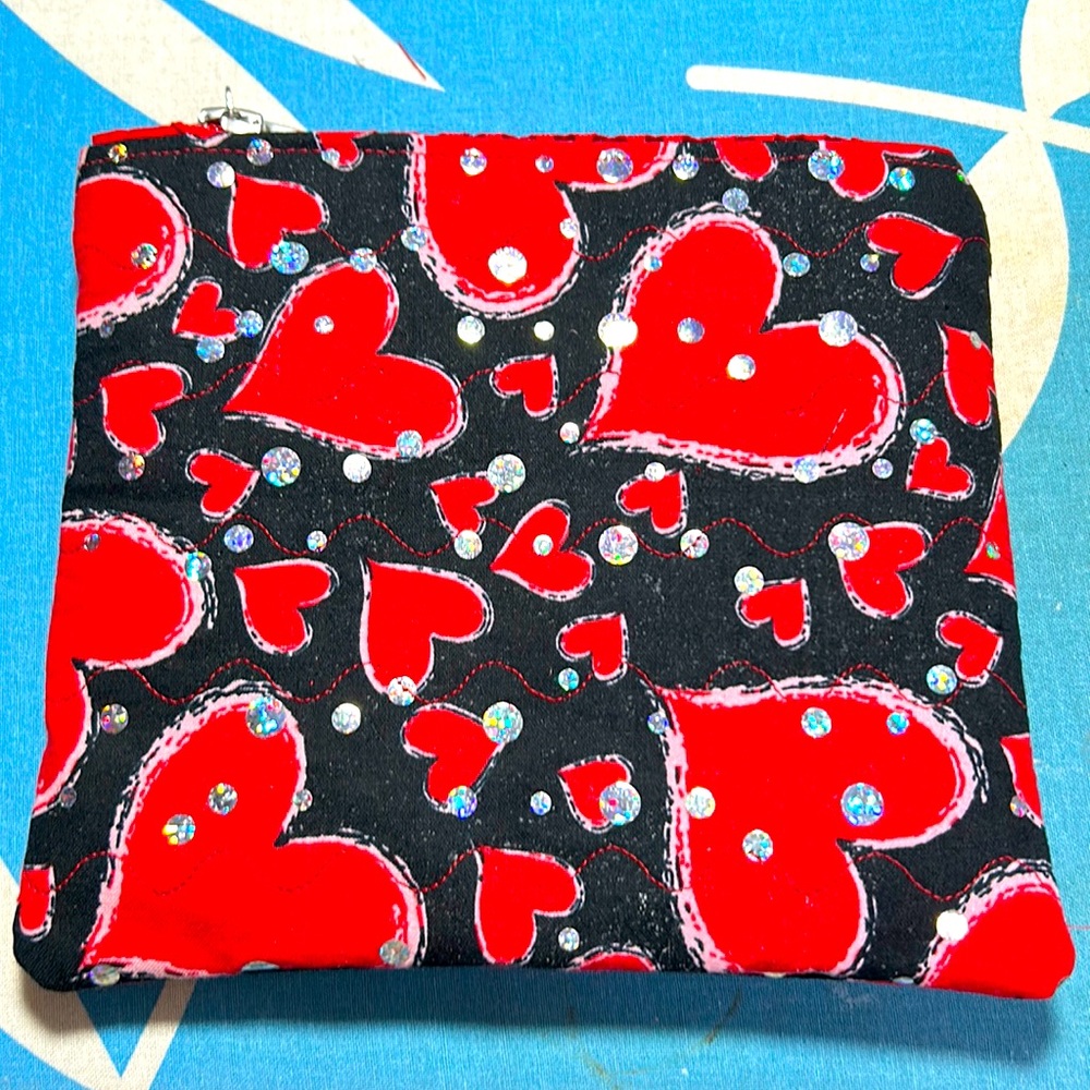 Valentine Quilted Heart Cosmetic Bag. 7 1/4” W x 6 1/2” H.  Opens 5 1/4”